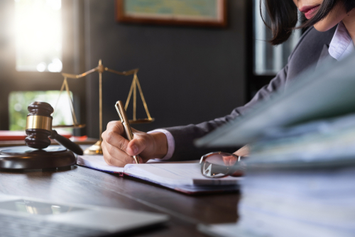 What Are The Top 3 Most Effective Defense Strategies For Sex Crime Cases in Phoenix That Lead To Case Dismissal? Phoenix sex crime defense attorney doing court case paperwork